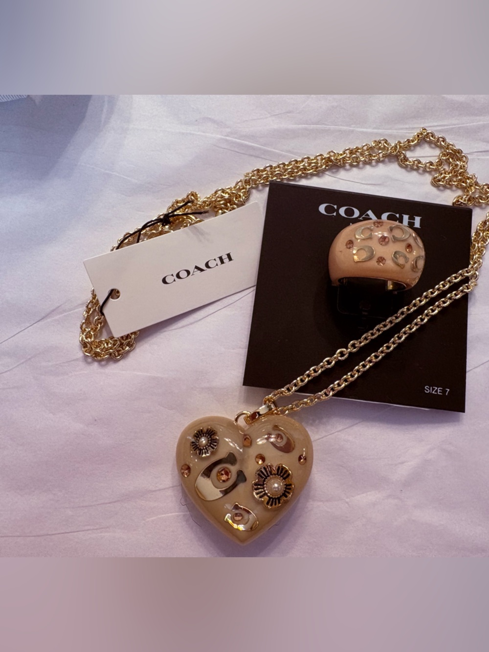 Coach Gold-Tone Chain Necklace with Beige Heart Charm and Decorative Accents